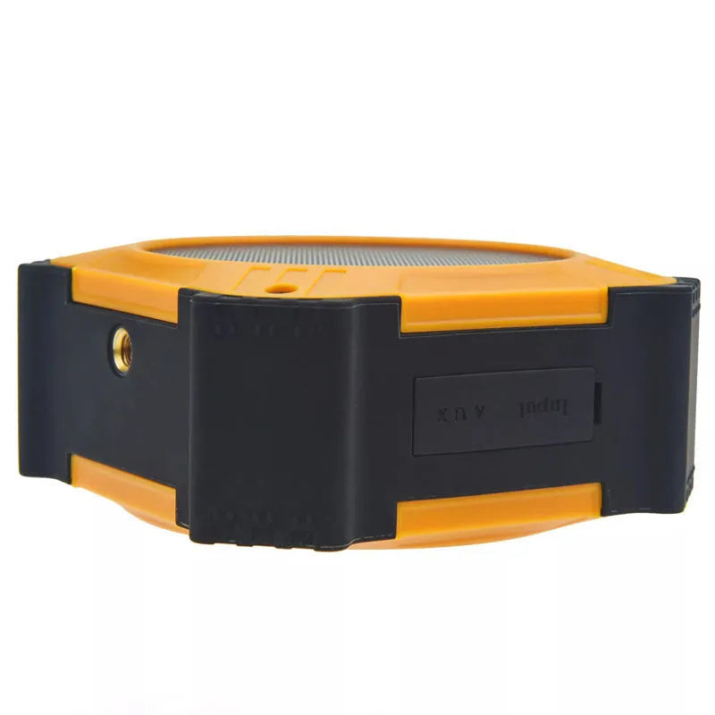 Black waterproof Bluetooth speaker showing compact cube design with control buttons and wrist strap attachment