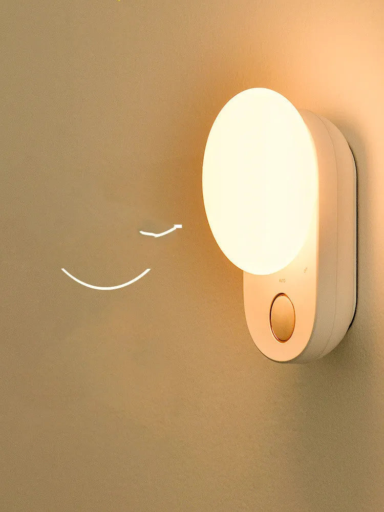 White Baseus rechargeable motion sensor LED night light for bedside or hallway use.