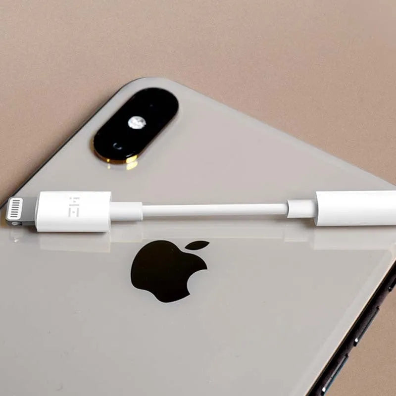 White lightning to 3.5mm audio adapter cable for iPhones showing three variant connectors