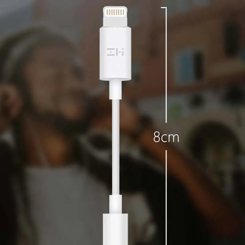 White lightning to 3.5mm audio adapter cable for iPhones showing three variant connectors