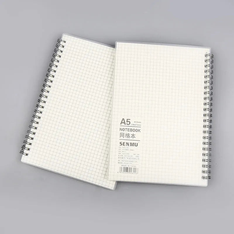 Creative coil notebook open showing grid pages, available in A5, B5, and A6 sizes