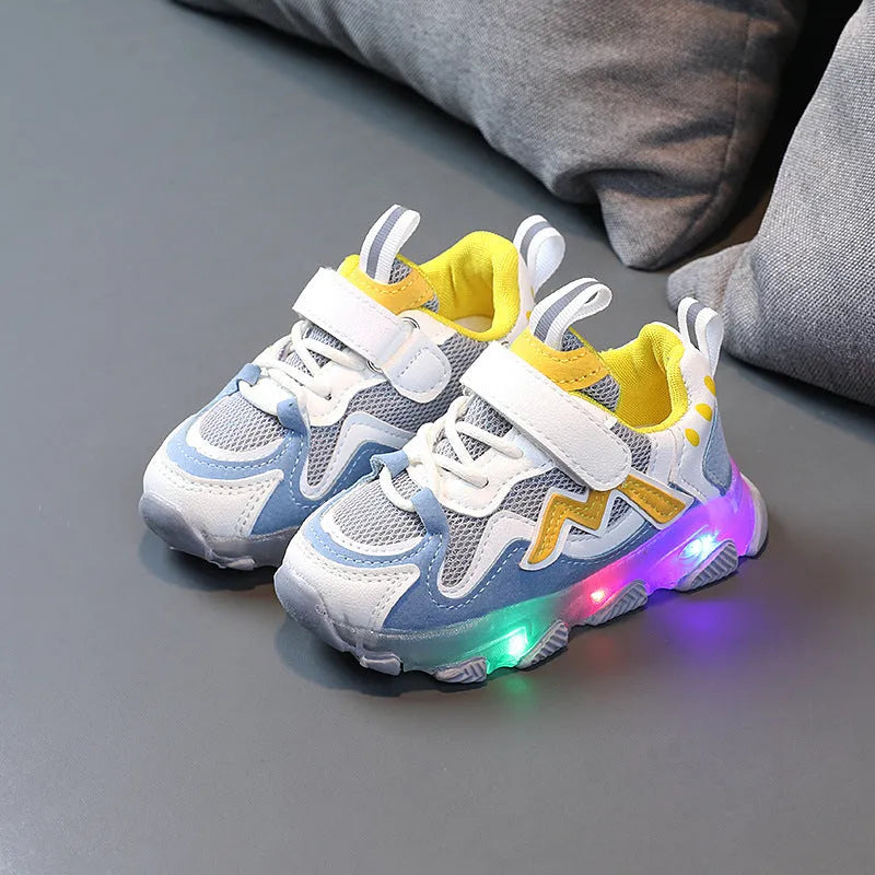 Kids black mesh velcro sneakers with a bright light on the sole, shown on a size chart.