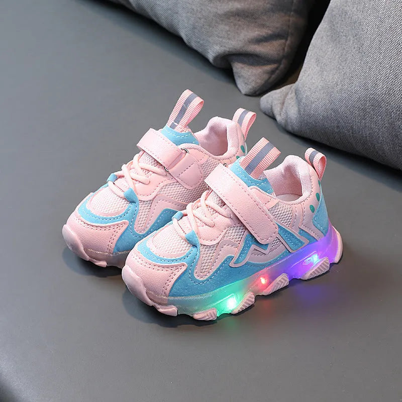 Kids black mesh velcro sneakers with a bright light on the sole, shown on a size chart.