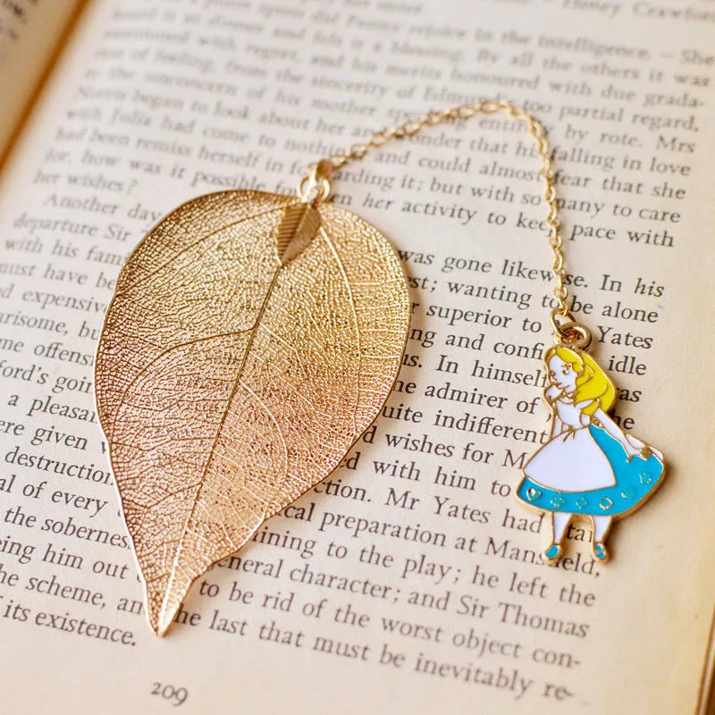 Three decorative alloy bookmarks featuring Alice, rabbit and clock designs on a leaf-shaped base