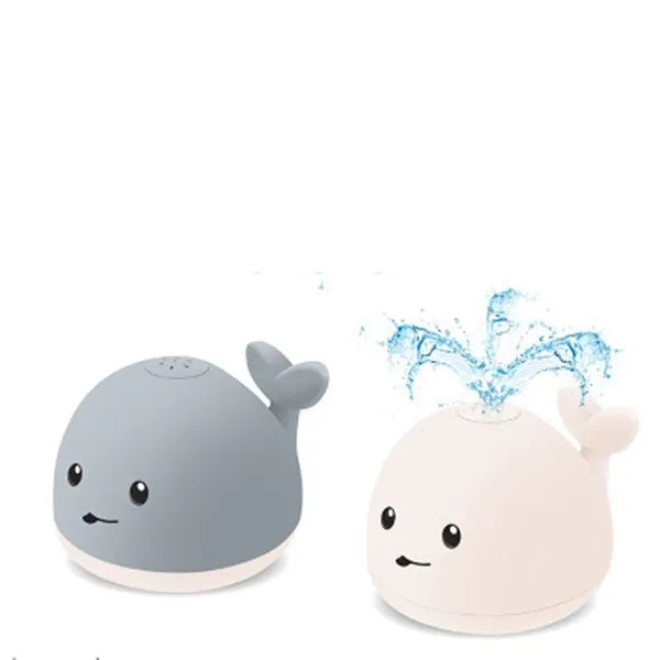 Grey or white cartoon whale bath toy that sprays water with LED lights and music