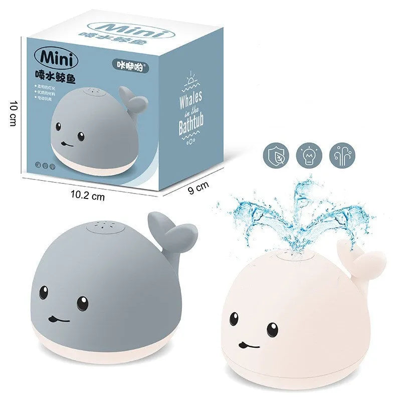Grey or white cartoon whale bath toy that sprays water with LED lights and music