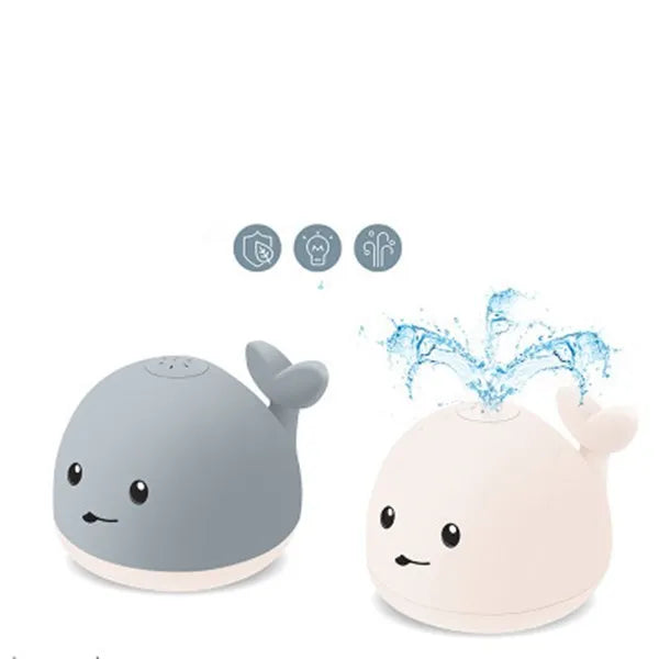 Grey or white cartoon whale bath toy that sprays water with LED lights and music
