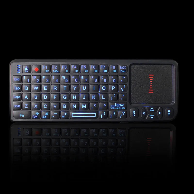 Compact black wireless mini keyboard with touch screen and matching mouse on a desk.