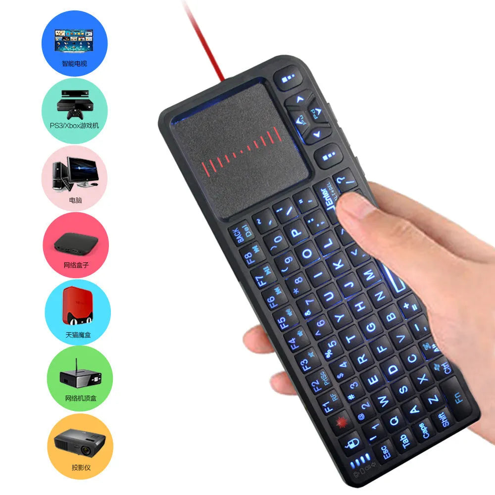 Compact black wireless mini keyboard with touch screen and matching mouse on a desk.