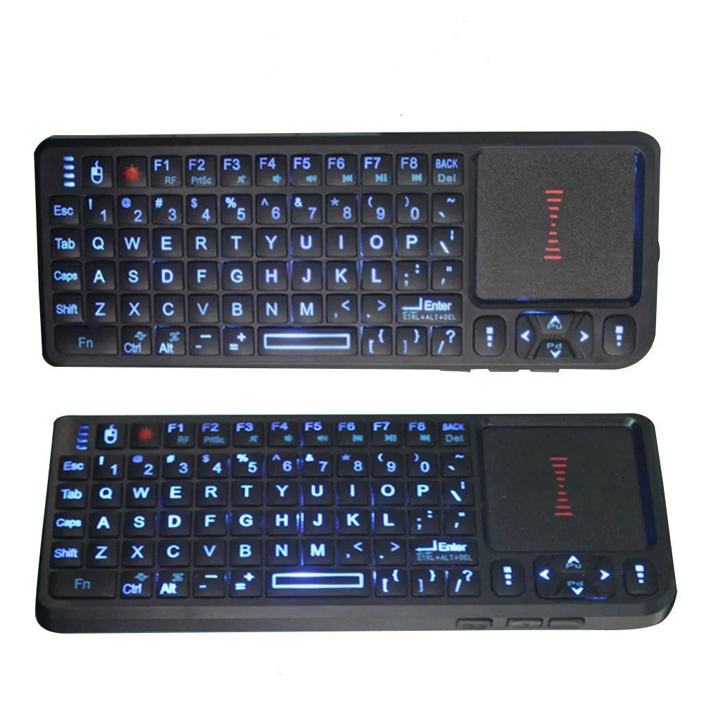 Compact black wireless mini keyboard with touch screen and matching mouse on a desk.