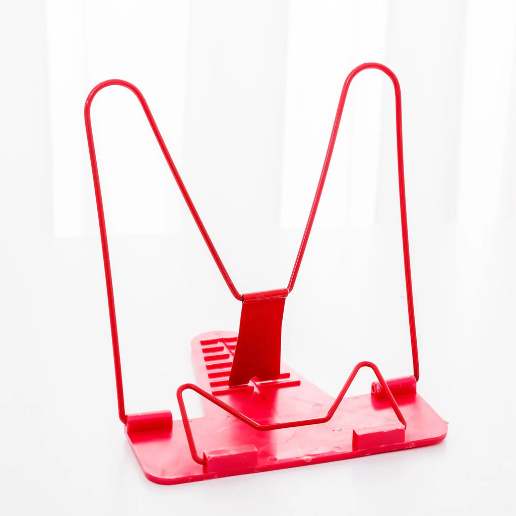 Red, green, and blue multifunctional reading frame made of metal and plastic on a desk