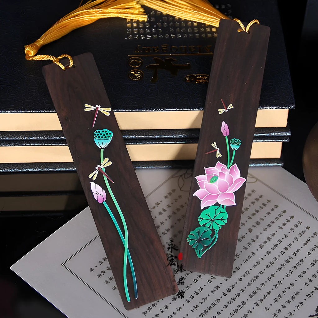 Chinese-style sandalwood bookmark with painted lotus floral design and polished finish