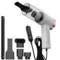 Black and white mini car vacuum cleaner with long cable and suction head accessories on a table.