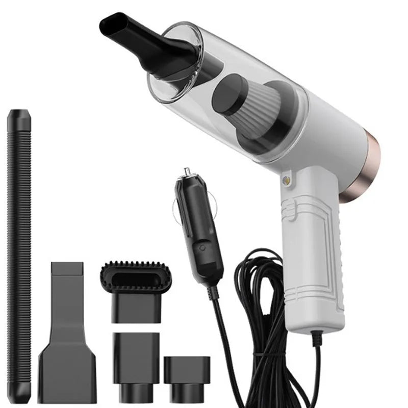 Black and white mini car vacuum cleaner with long cable and suction head accessories on a table.
