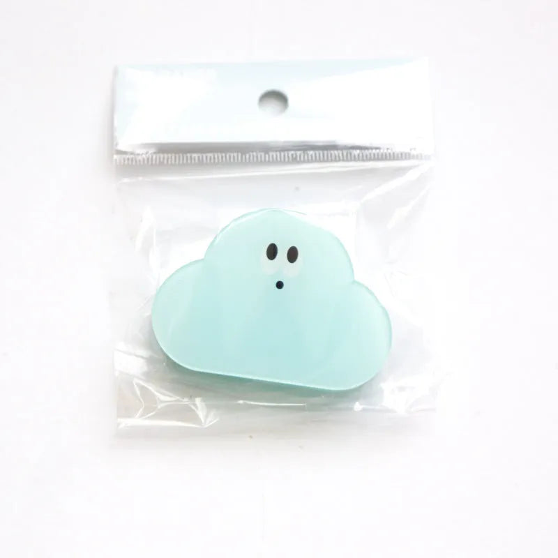 Colourful acrylic clip with cartoon collage design for scrapbooking and photo displays.
