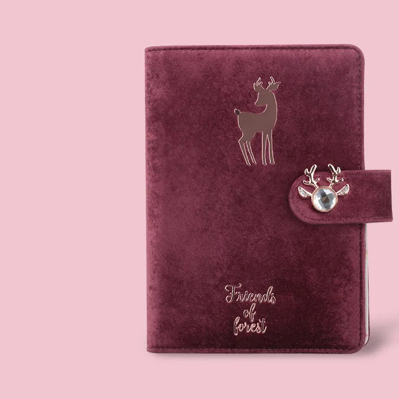 A6 loose-leaf notebook with a textured cloth cover, shown in a blue velvet colour variant, open to reveal binder rings.