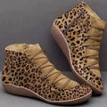 Women's casual flat ankle boots in artificial PU leather with a round toe and wedge rubber sole.