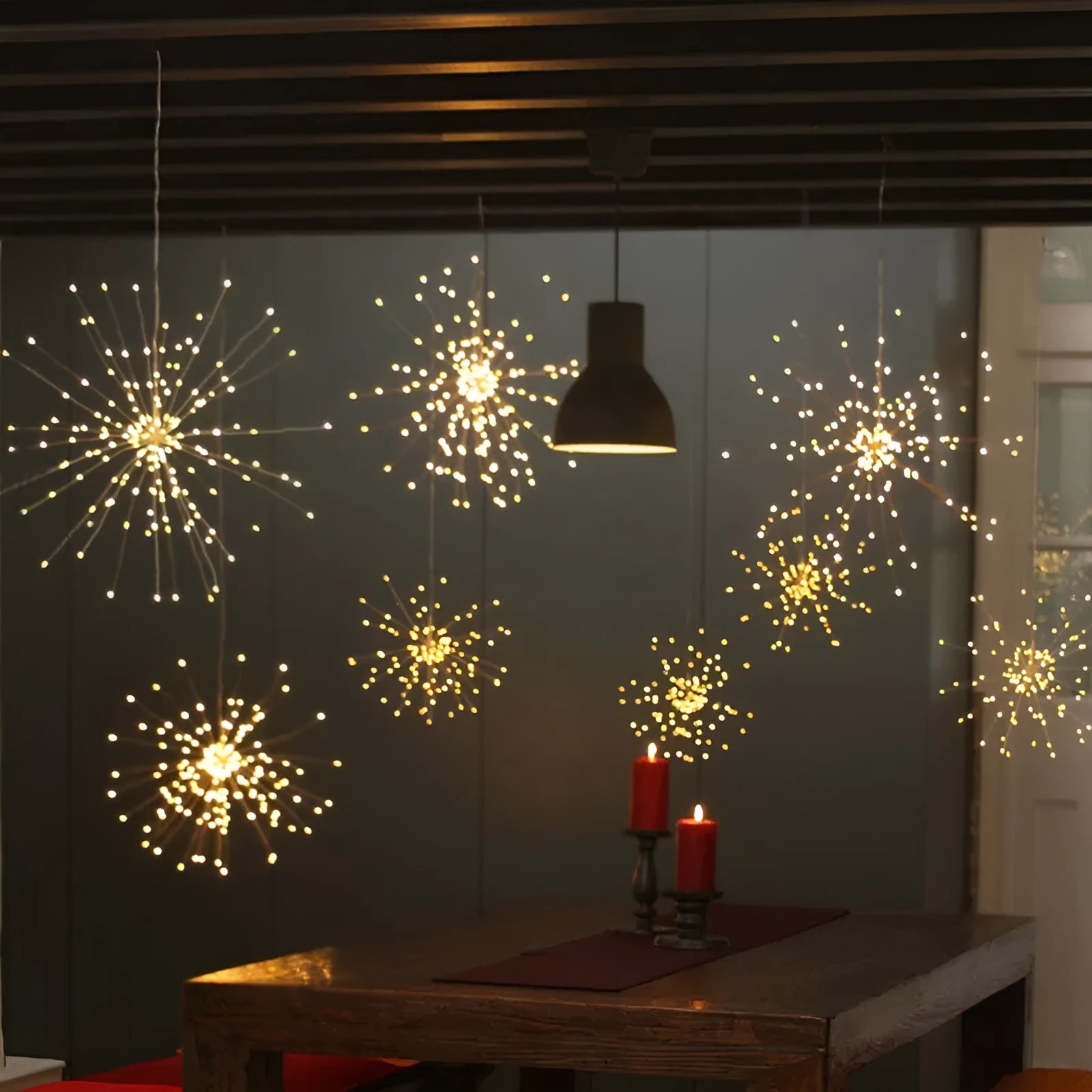 Solar-powered LED meteor shower chandelier light with multiple warm white LEDs for indoor or outdoor decoration.