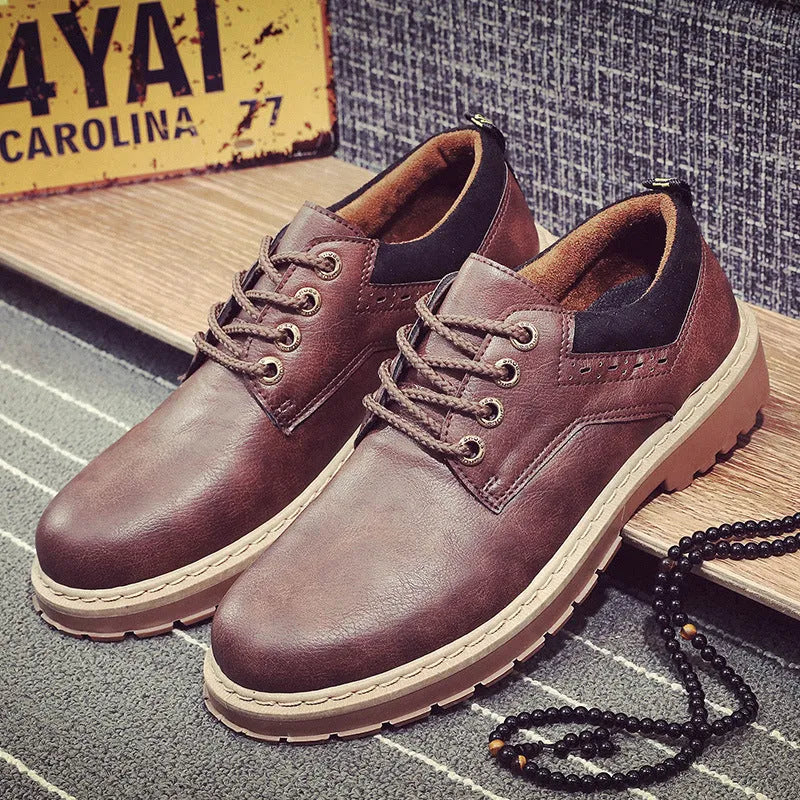 Men's black casual tooling shoes with a round toe and lace-up front on a rubber sole.
