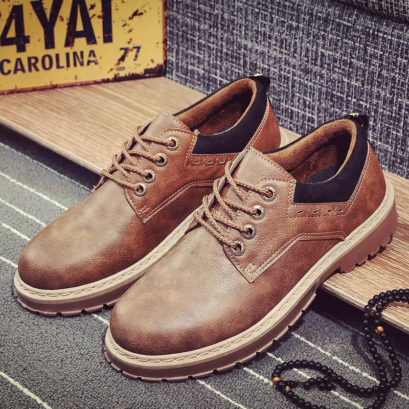 Men's black casual tooling shoes with a round toe and lace-up front on a rubber sole.