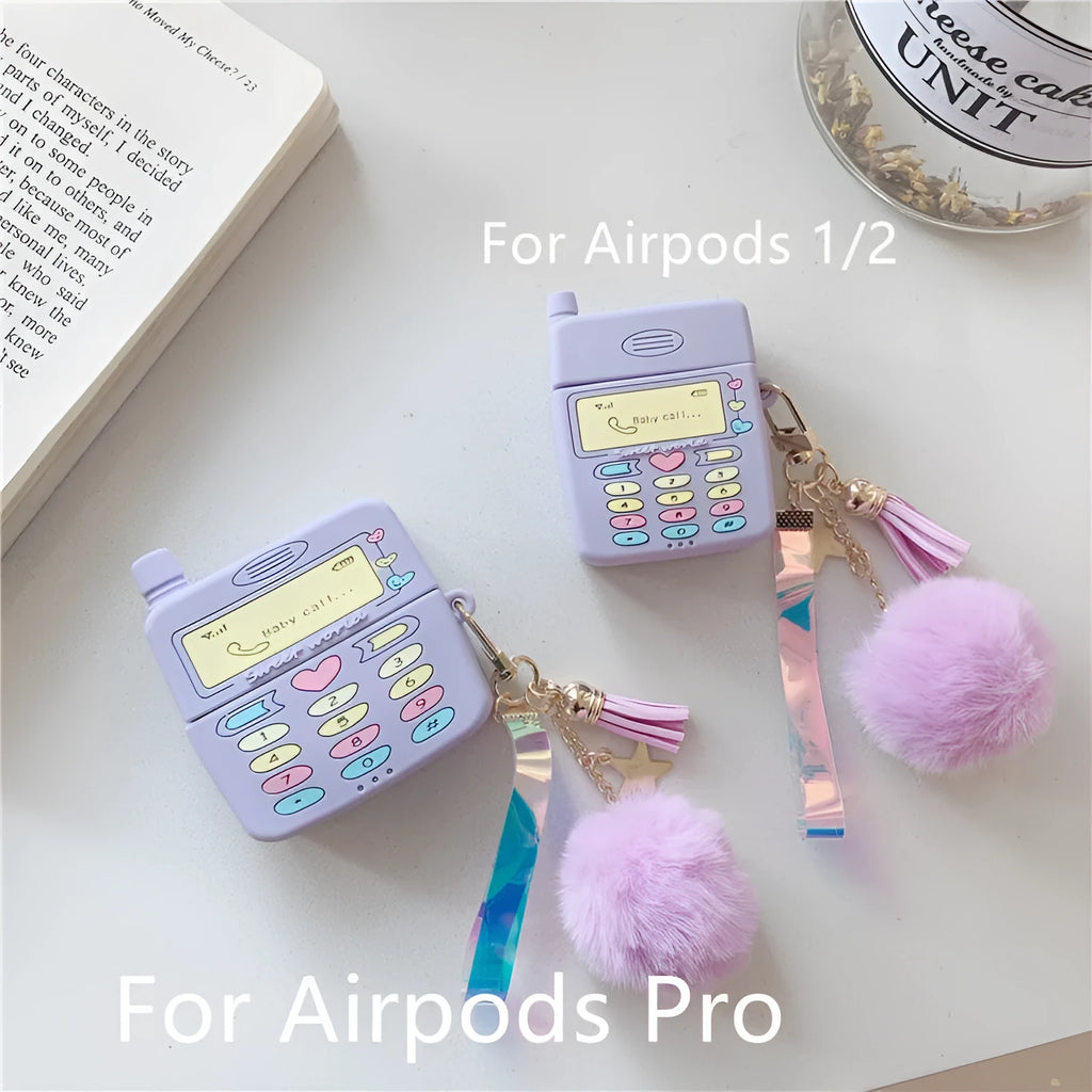 Purple silicone clamshell case for Apple AirPods with a small white fur ball pendant attached.