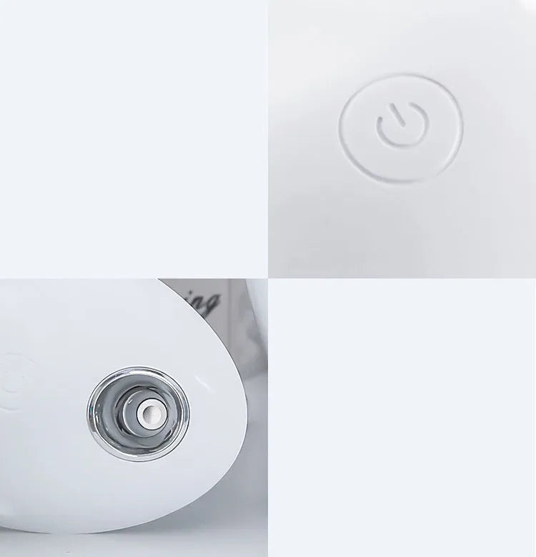Compact round white USB desktop humidifier and aromatherapy diffuser on a wooden table.