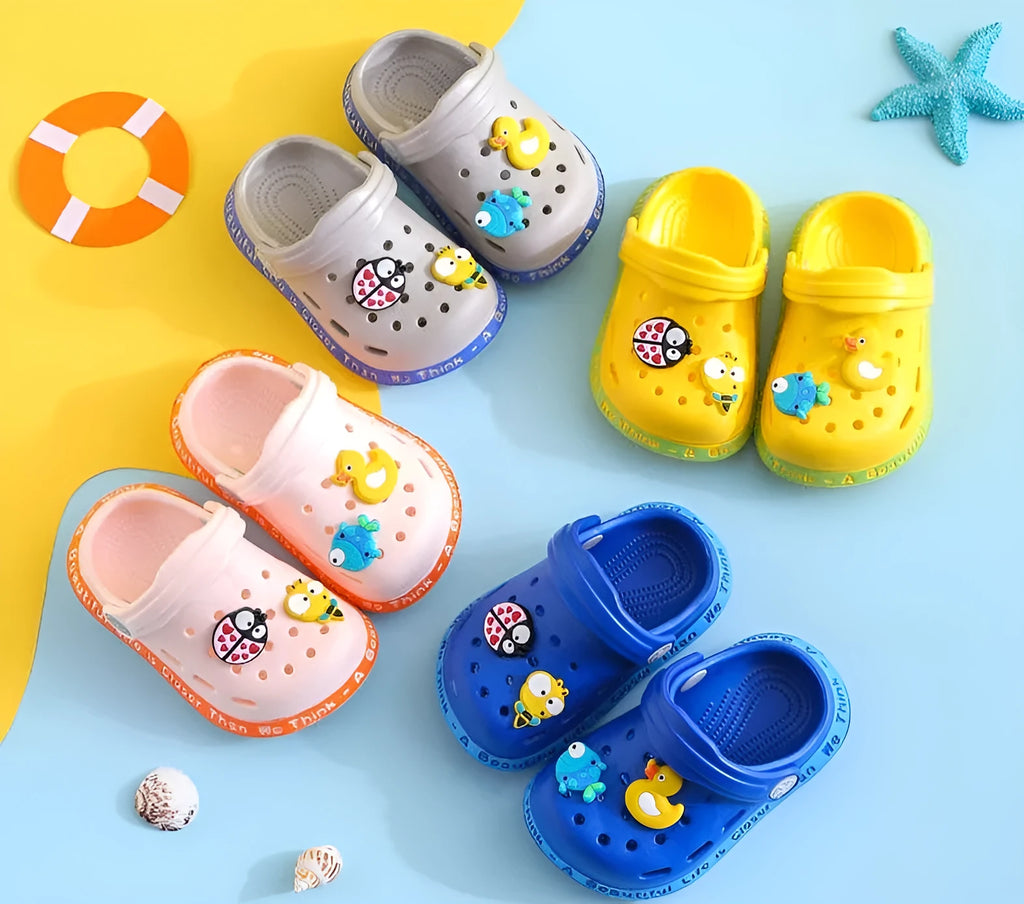Yellow PVC kids slippers with cartoon animal pattern and porous holes