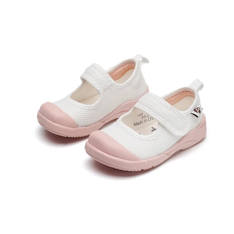 White children's cloth shoes with mesh upper and Velcro fastening for toddlers