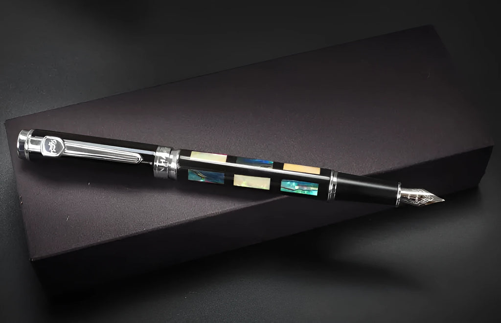 Ceramic colour lacquer pen with rotating ink system and interchangeable nib options in metal body