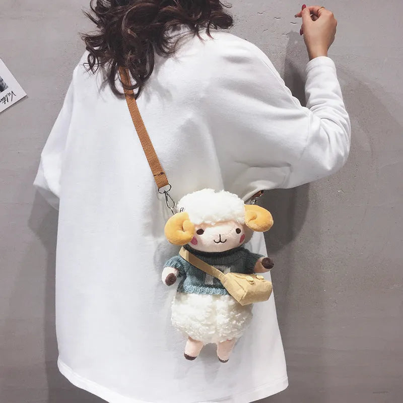 Small square plush crossbody bag with lamb pattern in blue colour showing zipper opening