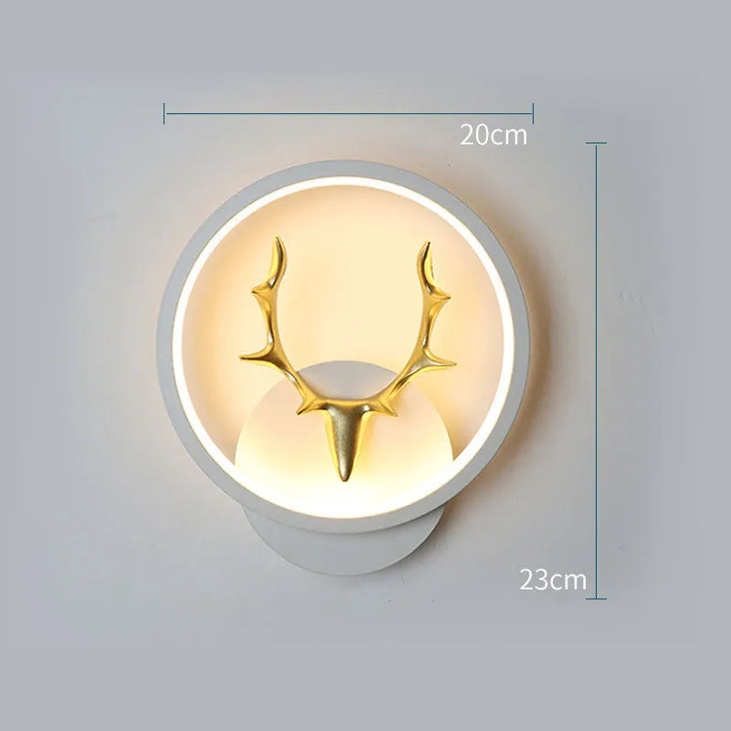 Deer antler shaped wall lamp with remote control on a light coloured wall