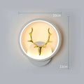 Deer antler shaped wall lamp with remote control on a light coloured wall