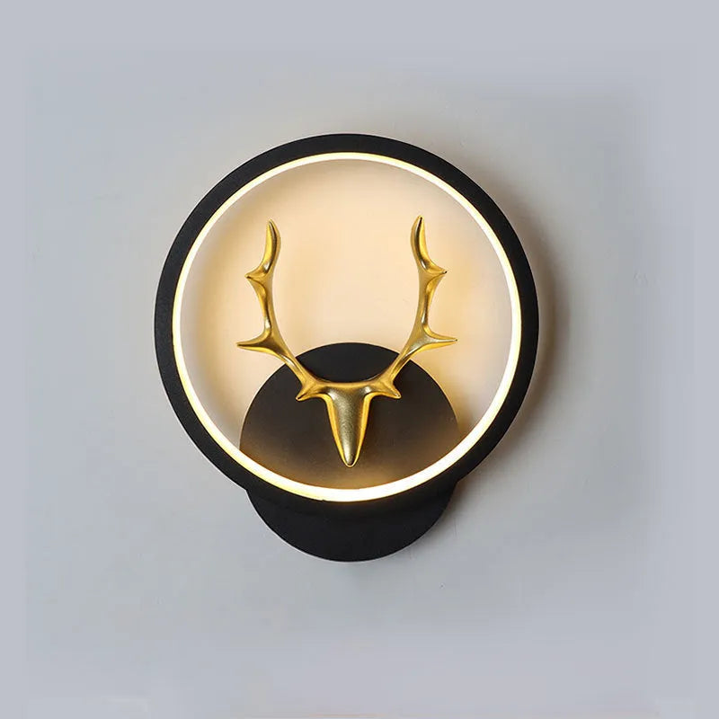 Deer antler shaped wall lamp with remote control on a light coloured wall