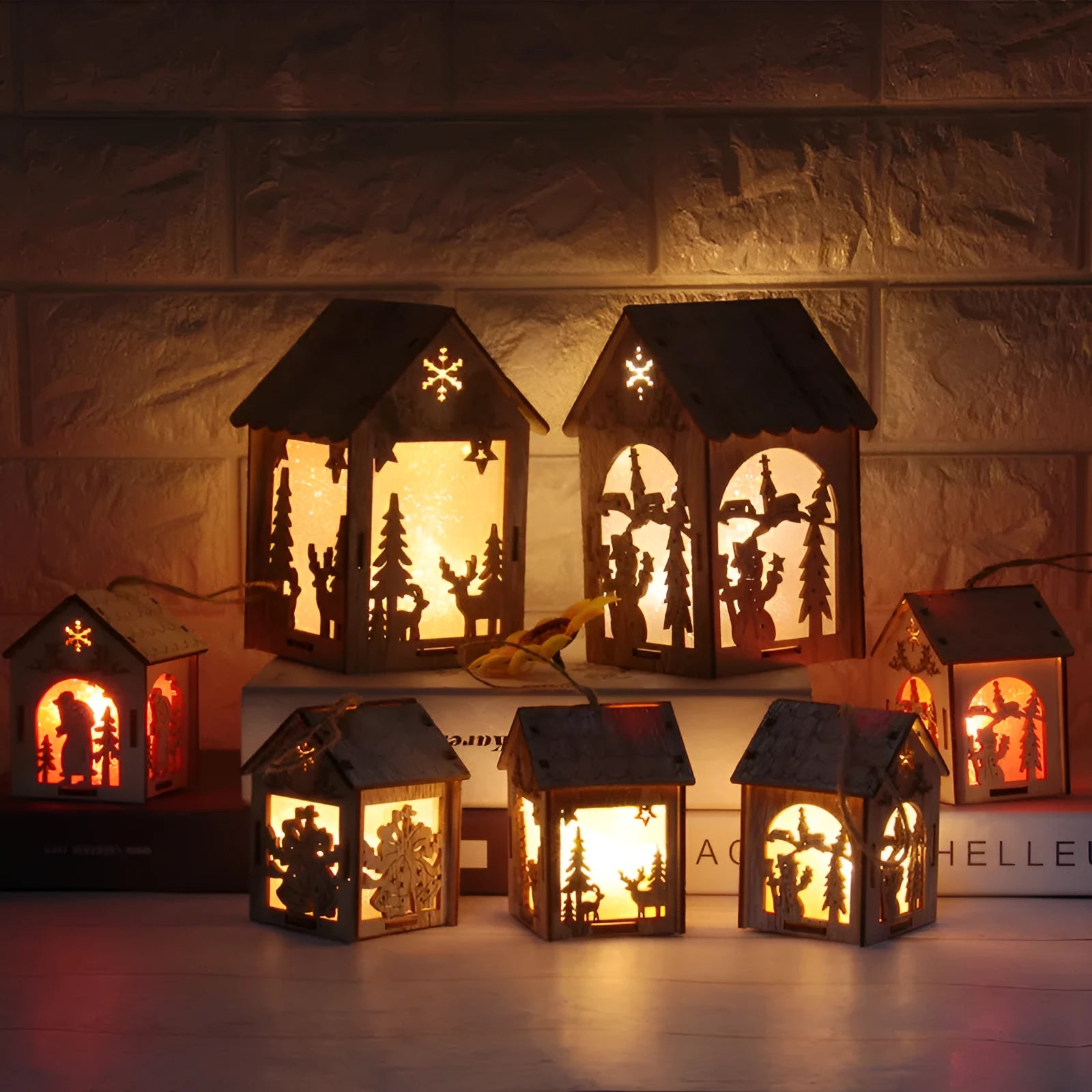 Three wooden Christmas house decorations: snowman, Santa Claus and bell designs in natural wood finish