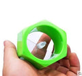 Yellow and green plastic spiral vegetable cutter for slicing cucumbers on a kitchen counter