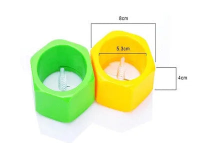 Yellow and green plastic spiral vegetable cutter for slicing cucumbers on a kitchen counter
