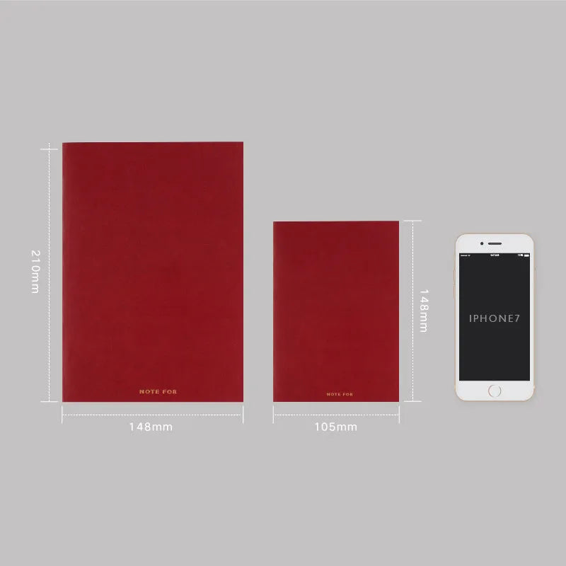Red imitation leather hand book grid notebook showing inner core dot matrix pages with bronze detailing