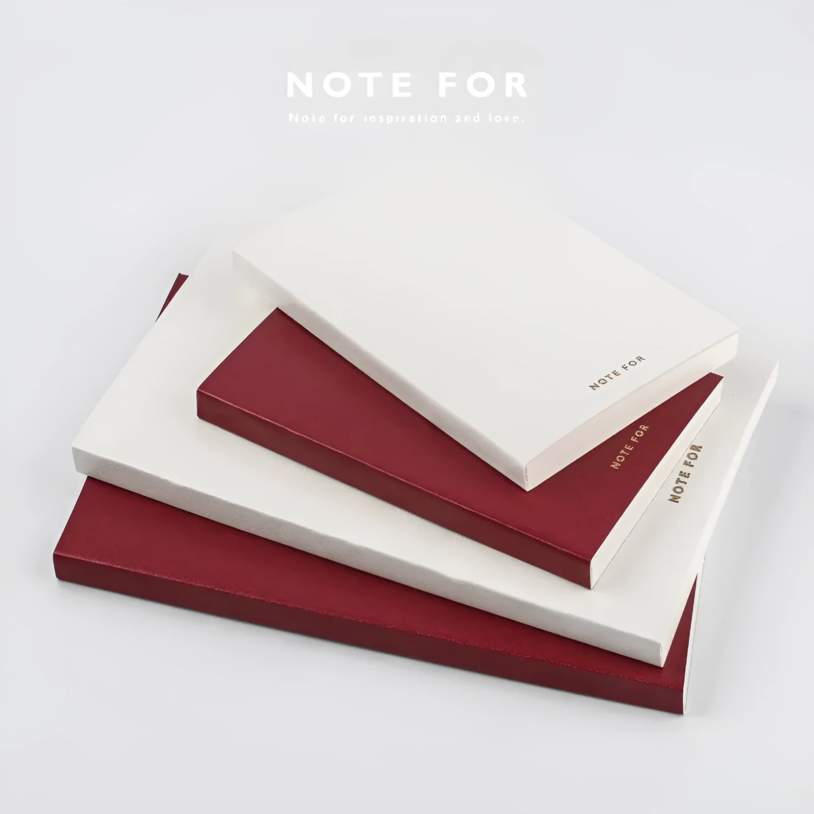 Red imitation leather hand book grid notebook showing inner core dot matrix pages with bronze detailing