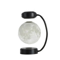 Black magnetic levitation moon lamp floating above base with touch control for bedside use