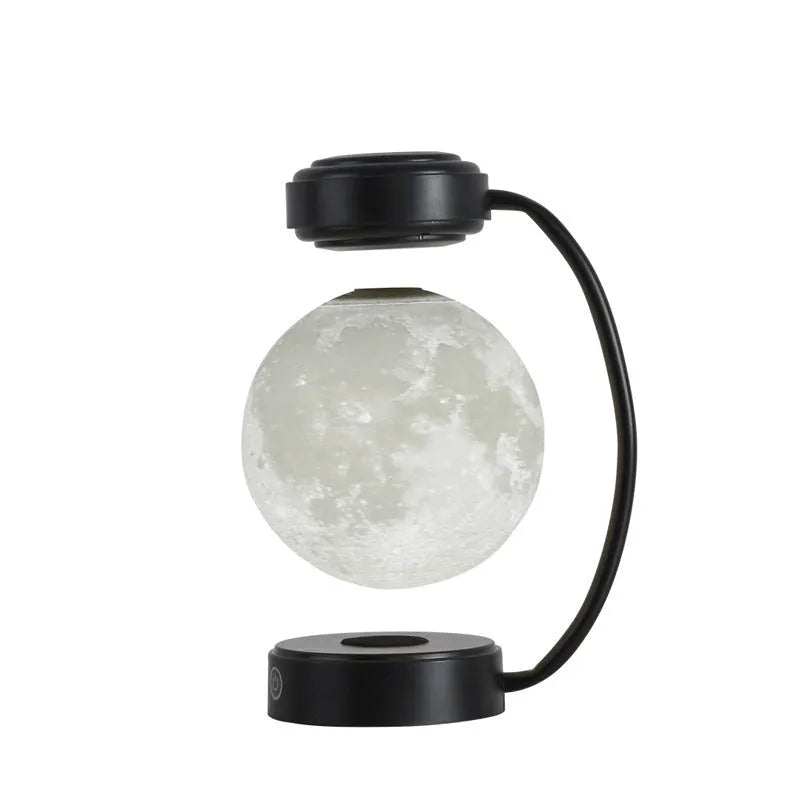 Black magnetic levitation moon lamp floating above base with touch control for bedside use