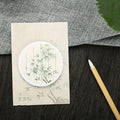 A pad of sticky notes with eight different illustrated leaf designs, including Water Lily and Maple Leaf motifs.