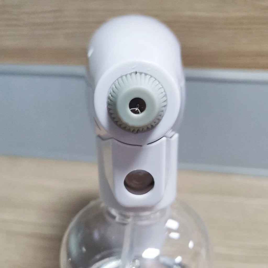 White handheld cordless electric spray disinfection gun with USB charging cable