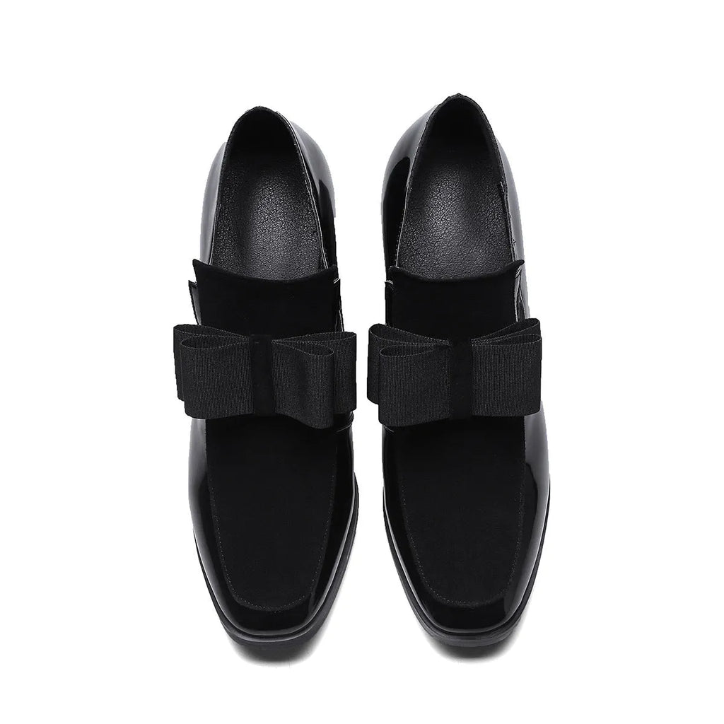 Women's black patent leather high-heel shoes with a thick heel and square toe.
