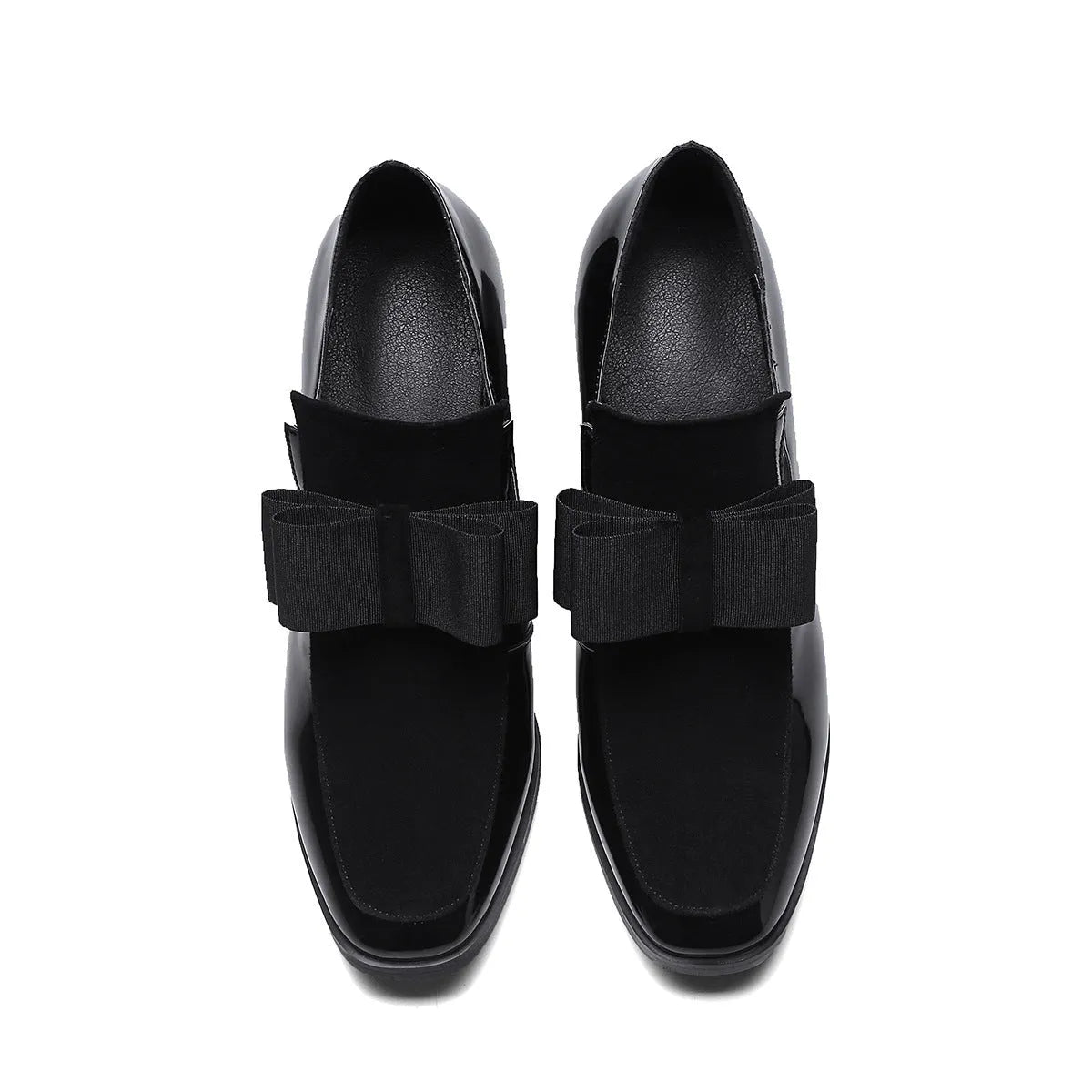 Women's black patent leather high-heel shoes with a thick heel and square toe.