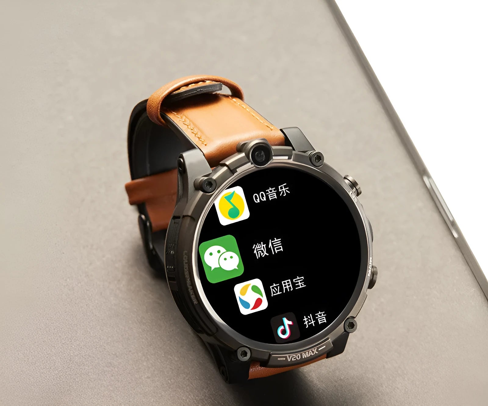 Black 4G smartwatch with 1.6-inch screen, dual cameras, and a wrist strap displayed on an adult wrist.