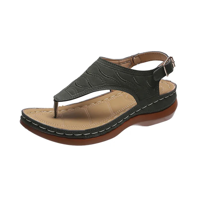 Women's black casual wedge heel sandals with an adjustable buckle strap on ankle.