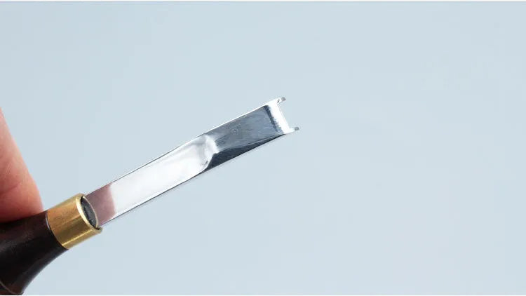Leather working wide shovel edge thinning knife, a manual hand tool for skiving.