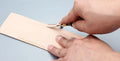 Leather working wide shovel edge thinning knife, a manual hand tool for skiving.