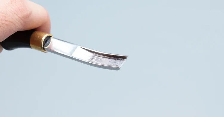 Leather working wide shovel edge thinning knife, a manual hand tool for skiving.