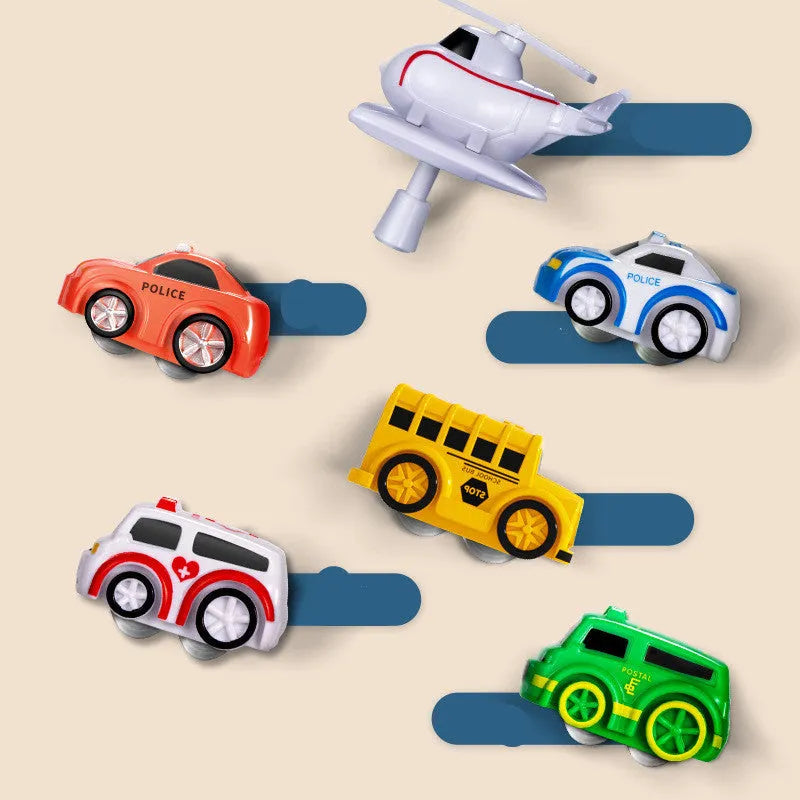 Children's car parking lot toy with crane, conveyor belt, and multiple vehicles including police car and ambulance